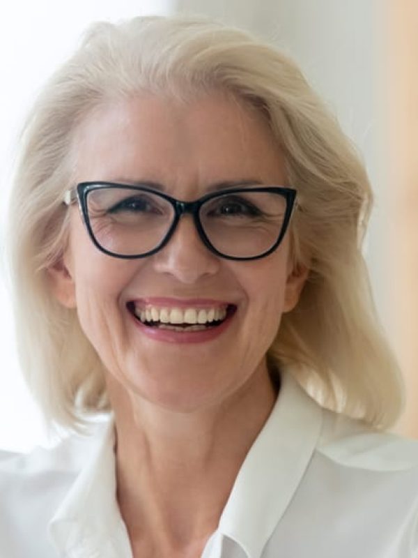 Headshot,Portrait,Of,Happy,Aged,Grey-haired,Businesswoman,In,Glasses,Look